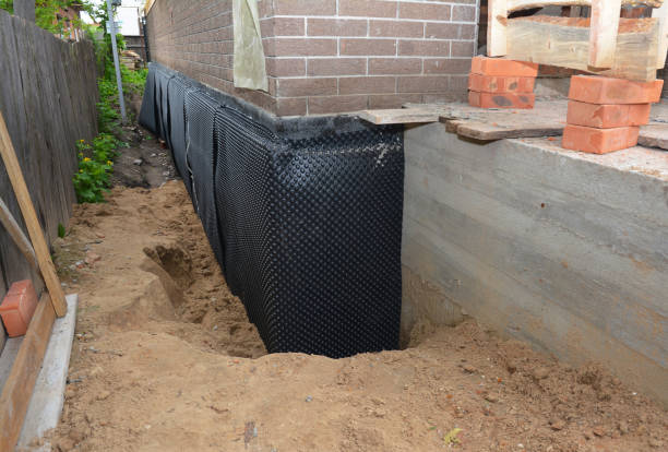 Happy homeowners after waterproofing job in Port Gibson